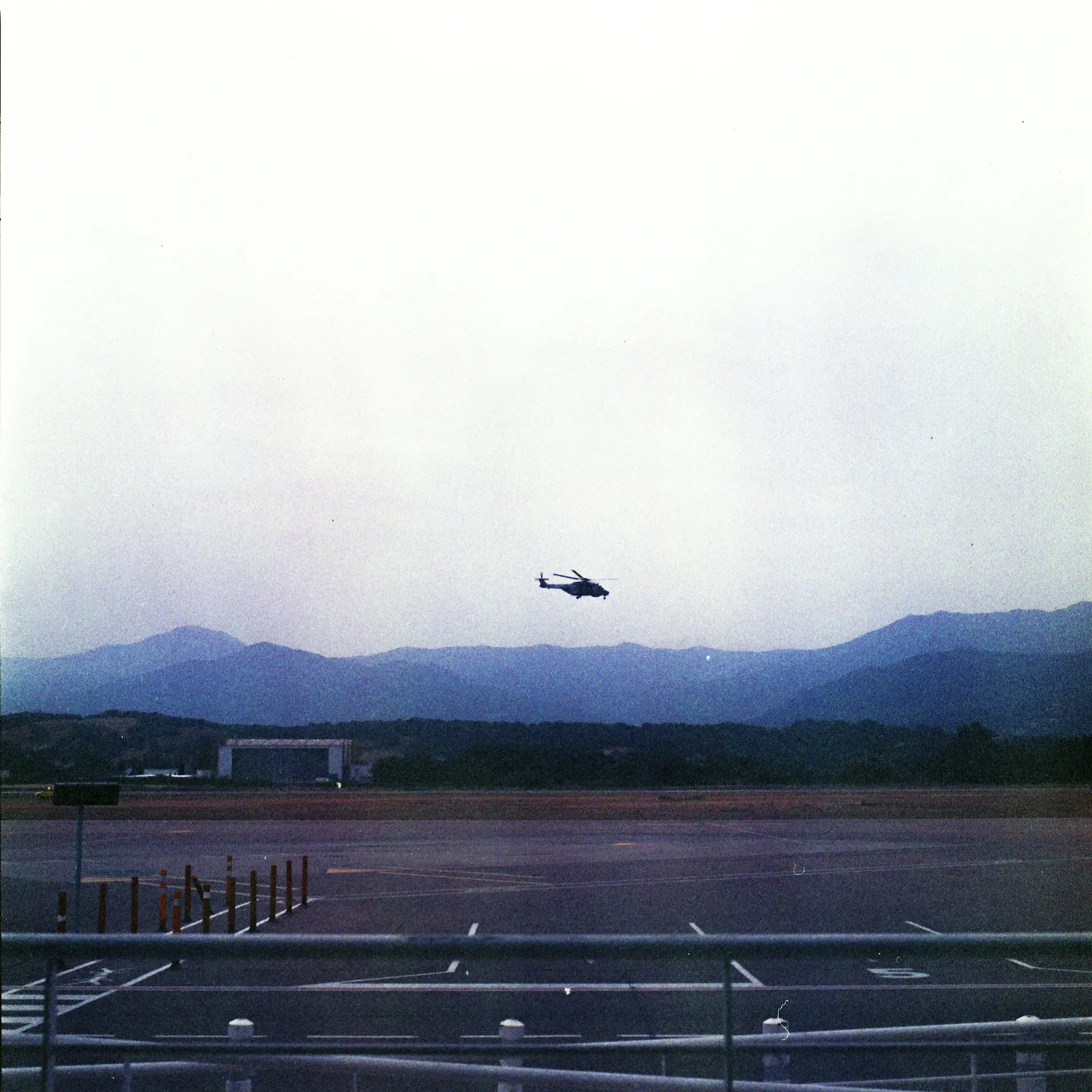 Helicopter above runway, Corse